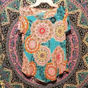 Women's size medium multi colored floral blouse by Amana-polyester blend
